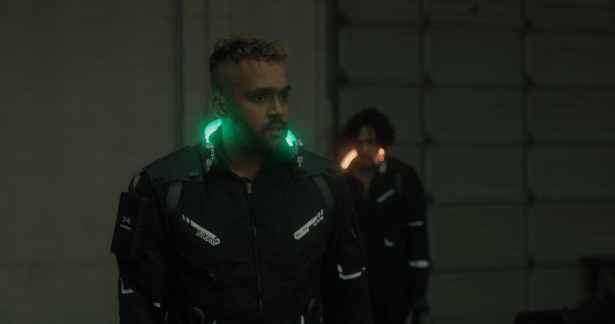 Rayniel Rufino and Scotty Tovar in Scumbags, lit by green collar lights